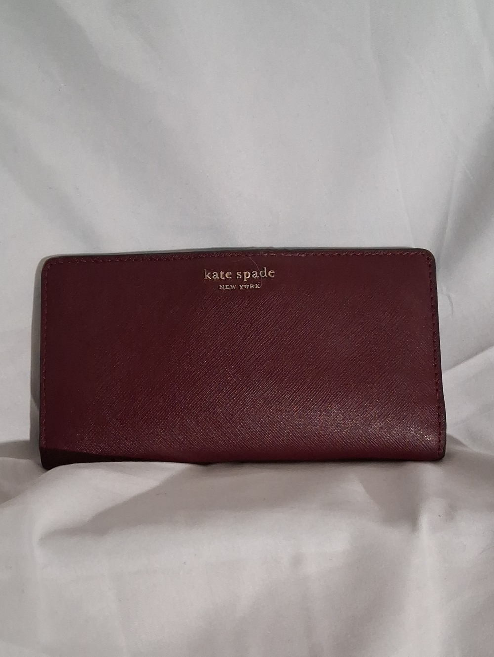 kate spade burgundy zip-around Saffiano leather wallet
